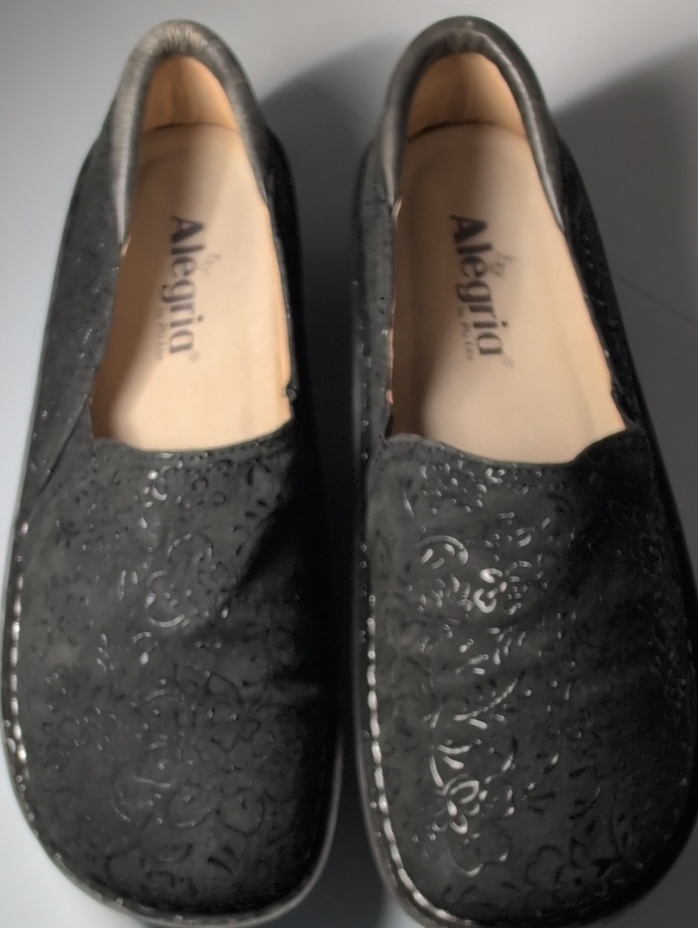 Alegria Black Floral-Embossed Slip-Ons